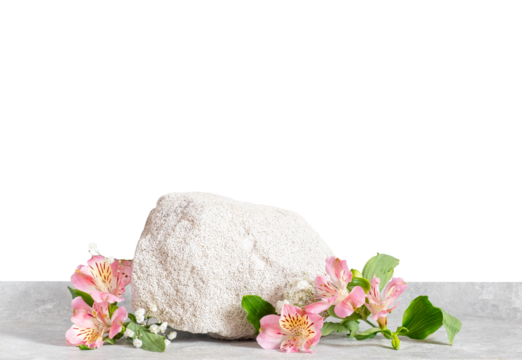 Soft white textured stone placed on light stone surface, decorated with delicate pink alstroemeria flowers and green leaves. Minimal spa or cosmetic product scene with clean transparence, copy space