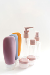 empty travel multi-colored cosmetic bottles