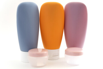 empty travel multi-colored cosmetic bottles