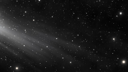 Fototapeta premium Countless stars populate the night sky, showcasing a stunning display of celestial bodies. A luminous comet tail streaks across the black expanse, adding a dynamic element to the cosmic view