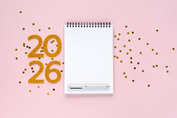 2026 New Year concept with empty notebook for your goals, plans, resolutions. Flat lay style. Christmas planning concept with space for text