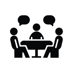 Two people discuss with another person on a screen at the table