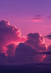 Dramatic clouds illuminated by a surreal, vibrant pink and purple atmosphere during a spectacular celestial light show ,bright ,magenta ,sunset