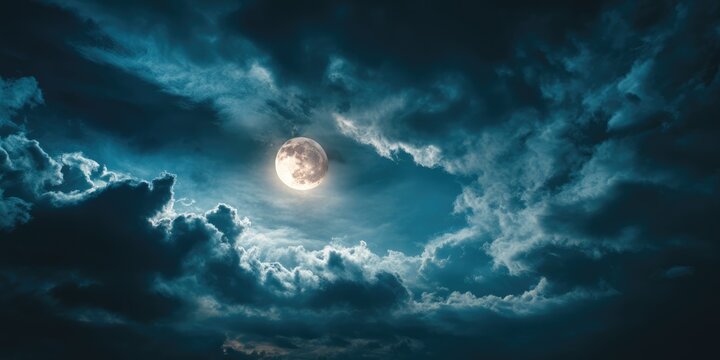 Dramatic Full Moon in Cloudy Night Sky