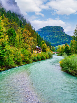 Alpine house on a cliffside above the Berchtesgadener Ache river, Marktschellenberg, Germany