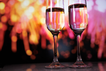 Love celebration fireworks, Romantic partners share toast surrounded by dazzling fireworks display