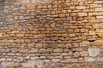 Texture of ancient stones in the town of Sarlat in France