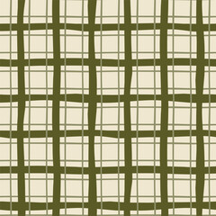 Fototapeta na wymiar Green checkered Christmas plaid seamless pattern. Hand drawn winter holiday tartan plaid. Scottish cage textile design, cozy traditional New Year repeat background, fabric, print, wrap paper in vector