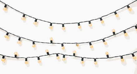 Three strands of warm-toned fairy lights are strung against a plain white background, creating a festive and inviting atmosphere perfect for celebrations.