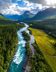 Aerial View of River Flowing Through Forest and Mountains.
