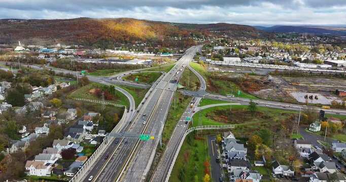 Fall afternoon aerial video of the Interstate 81 and Route 17 interchange north of Binghamton, NY.