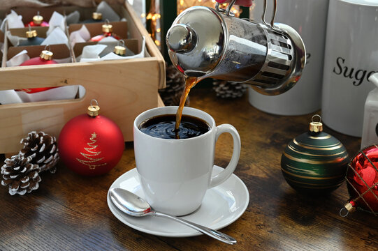 Pouring coffee from a French press at Christmas - Powered by Adobe