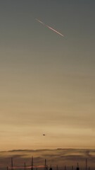 airplane in the sky at sunset