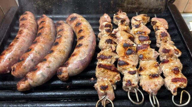 Grilled Shish Kebab and Sausages on BBQ, Traditional Balkan Bulgarian Serbian Greek Romanian Food Cuisine