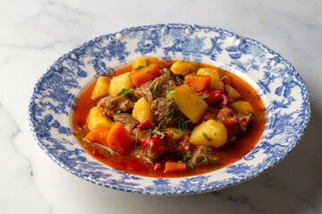 Veal sauce, soups and stews, beef, steak, potatoes, and plenty of paprika. A traditional Hungarian dish.