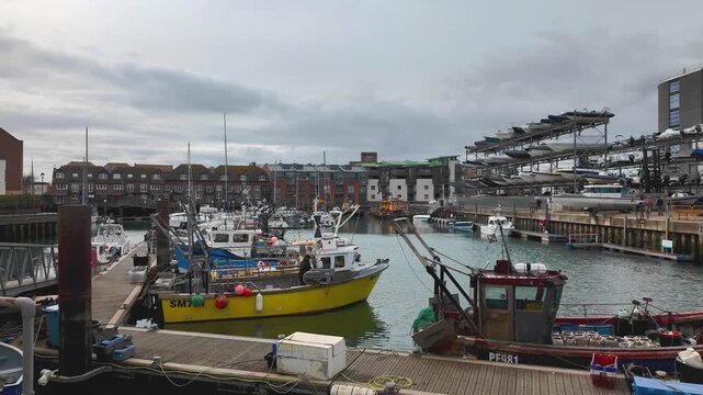Fishing and working boats moored in Camber Quay, Portsmouth