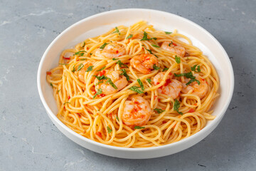 Delicious shrimp spaghetti with tomato sauce and parsley, Italian cuisine
