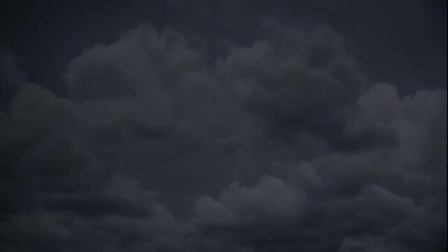 View of dark and ominous storm clouds filling the sky with a sense of foreboding weather pattern