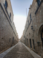Discover the enchanting charm of a narrow street located in a historic and beautiful town