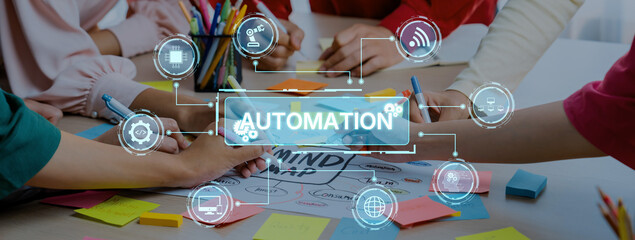 Hands engaged in collaboration while developing automation strategies with digital icons and colorful sticky notes, symbolizing innovative business practices. Trope