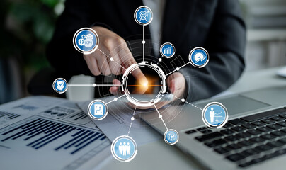 A business professional interacts with a touchscreen interface displaying various metrics and visualizations in a modern office setting, highlighting data analysis. Crux