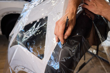 Applying a Protective Film on the Surface of Your Car for Enhanced Durability and Shine