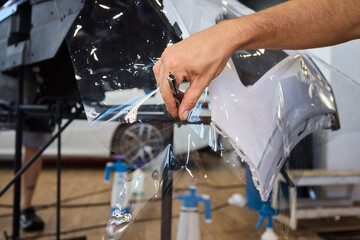 Applying a Protective Film on the Surface of Your Car for Enhanced Durability and Shine
