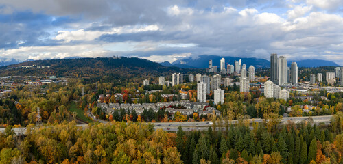 Autumn Cityscape Over Burnaby and Vancouver: Highrise Skyline Amid Forested Hills