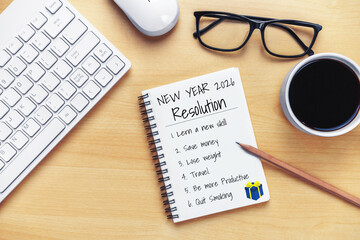 2026 Happy New Year Resolution Goal List and Plans Setting - Business office desk with notebook written about plan listing of new year goals and resolutions setting. Change and glee concept.