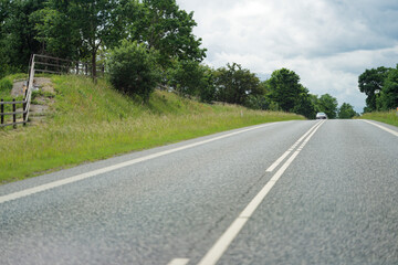 Two lane road with solid right edge and dashed left line