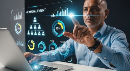Businessman interacting with digital graphs on laptop in office  