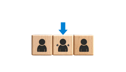 Three wooden blocks with stick figures, center one being targeted, marked with a blue arrow