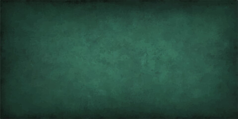 Dark, vintage green chalkboard wall with a textured, rough grunge surface for a blank backdrop