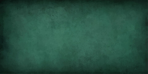 Dark vintage green chalkboard texture on a concrete grunge wall surface