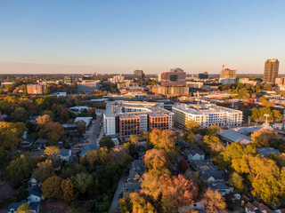 Fototapeta premium Aerial Drone Images of Downtown Raleigh North Carolina Skyline at Golden Hour: Travel, Architecture, Cityscape, Business, Real Estate