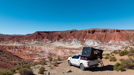 Camping on the road with a 4x4 off-road vehicle and a rooftop tent: an adventurous expedition in northern Argentina. Overlanding
