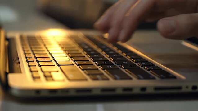extreme detailed photograph of a computer input device illuminated by a soft golden glow providing ample area for text insertion with a sharply focused