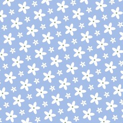 Charming seamless floral pattern with tiny white daisies on a soft blue background.