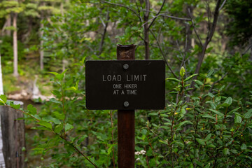 Load Limit Sign At Suspension Bridge In Glacier