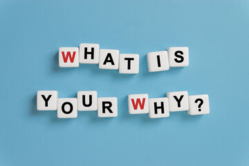 What is Your Why? by alphabets dice on blue background, existence of personal life, motivation concept
