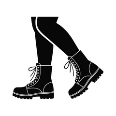 Black silhouette of legs wearing lace up combat boots with thick soles feet isolated white background.