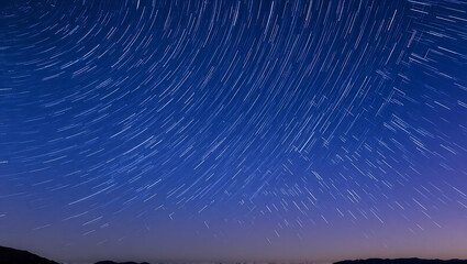 This image captures the view of star trails under the night sky