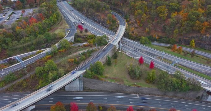 Fall afternoon aerial hyper lapse video over Interstate 87, 287,  Elmsford, NY in Westchester County.