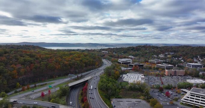 Fall afternoon aerial video over Interstate 87, 287,  Elmsford, NY in Westchester County.