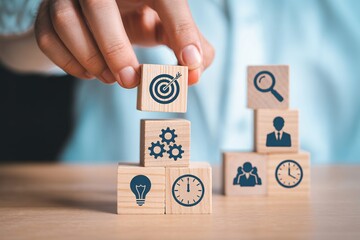 Business strategy planning with wooden blocks icons for target, ideas, time, teamwork and process.