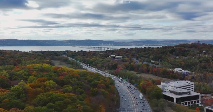 Fall afternoon aerial video over Interstate 87, 287,  Elmsford, NY in Westchester County.
