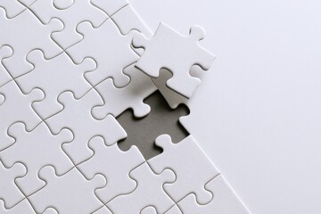Obraz premium White Puzzle Completion: Missing Piece Concept for Problem Solving, Strategy, and Business Solutions