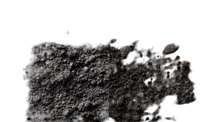 Close-up of freshly turned dark soil with small debris, set against a black void