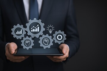 Business Man Holding Tablet with Digital Gears Representing Business Processes and Automation for Efficiency and Growth