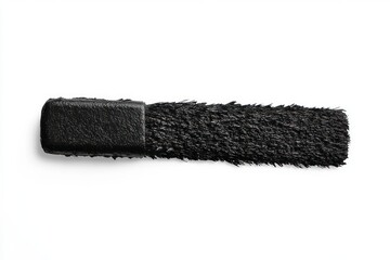 Smudge of thick black mascara brush stroke on white background showing textured bristles and creamy makeup product